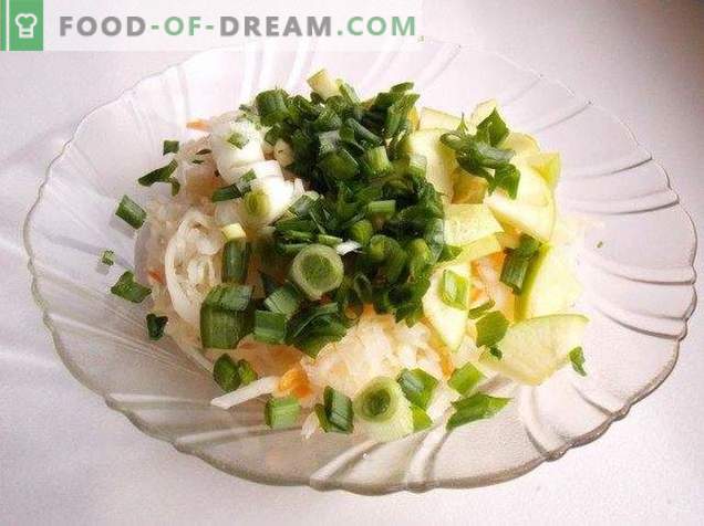 Salad from sauerkraut with apple and green onions